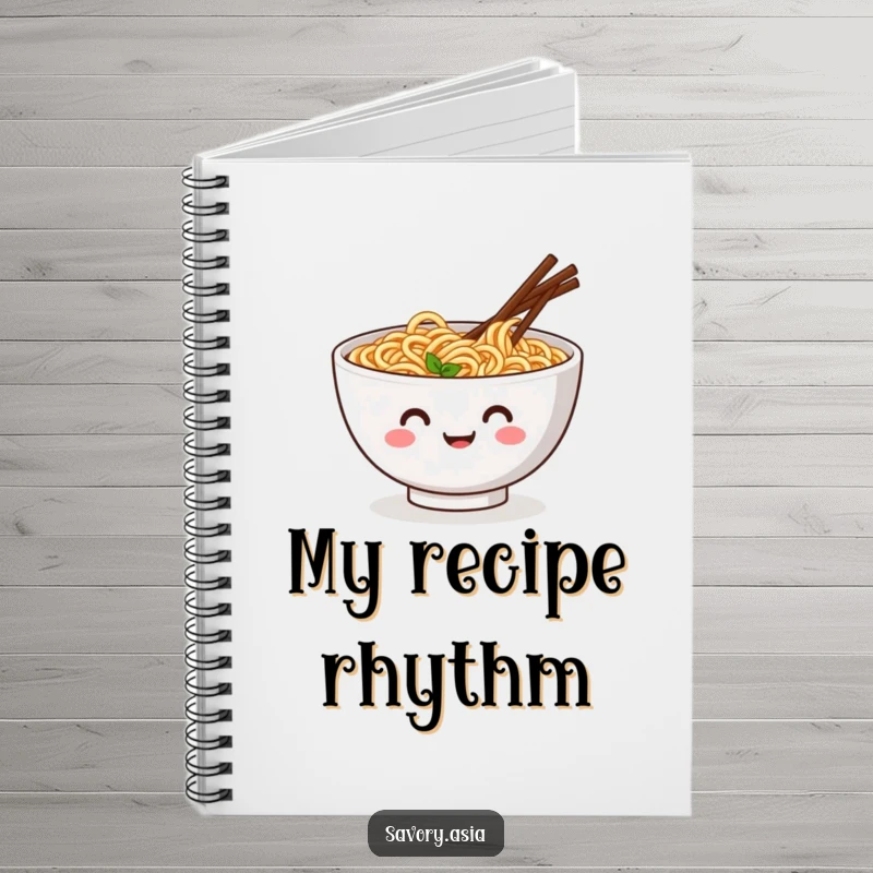 Funny notebook with a smiling ramen bowl and wiggling chopsticks doing a jig, designed for humorous recipe writing.
